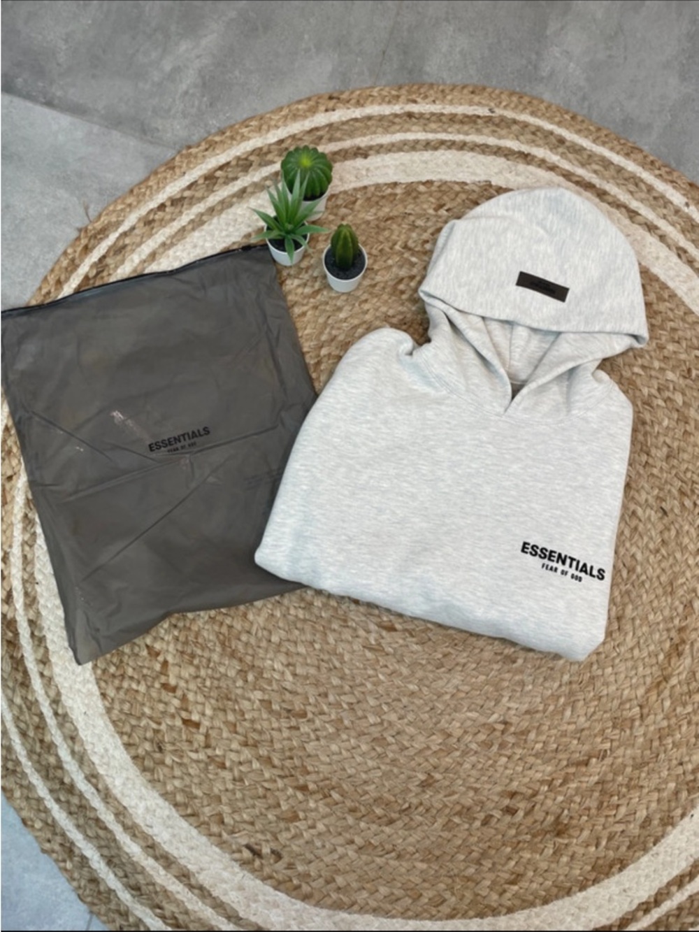 Classic grey hoodie with front pocket Essentials brand